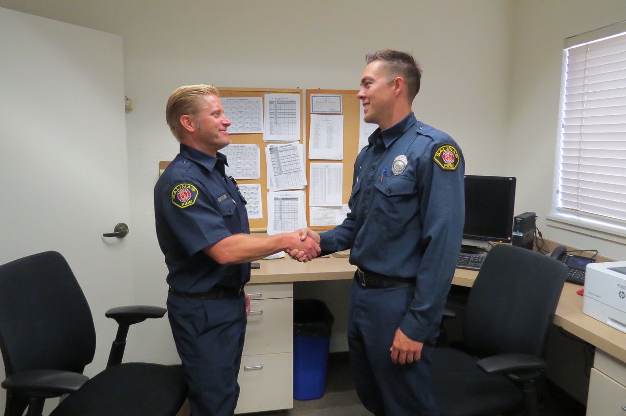 image of two officers shaking hands
